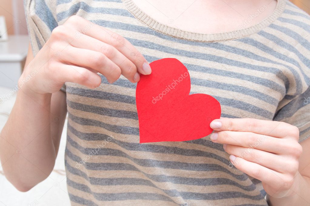 Red heart in hands