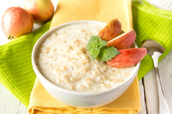 Oatmeal porridge with apple Stock Image
