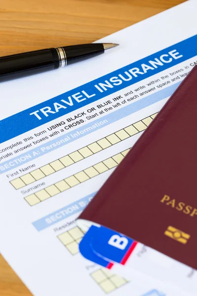 Travel insurance application form with pen and passport — Stock Photo, Image