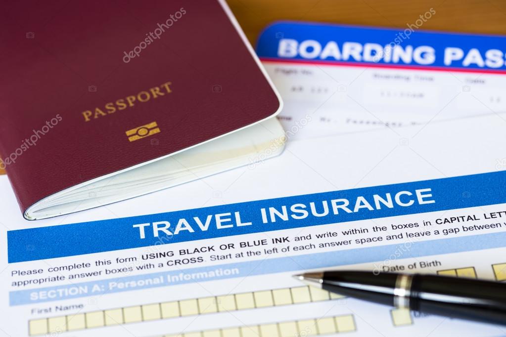 Travel insurance application form with pen and passport