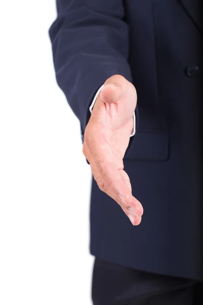 Geschäftsmann reicht Hand für Handschlag Stockbild