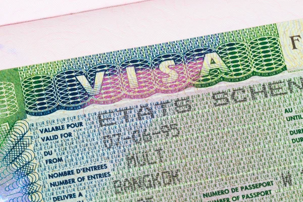 Visado Schengen en pasaporte macro —  Fotos de Stock