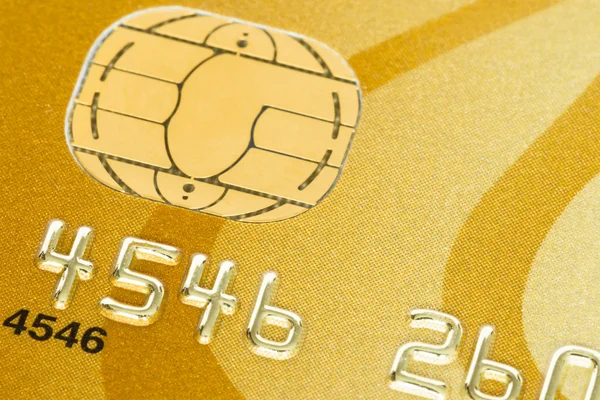 Gold credit card with micro chip selective focus — Stock Photo, Image