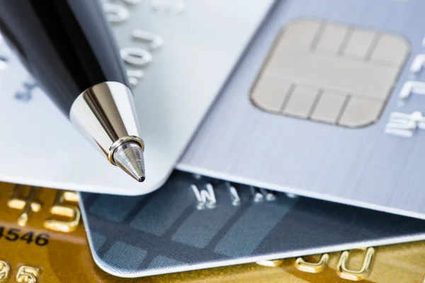 Pen on credit stack of cards — Stock Photo, Image