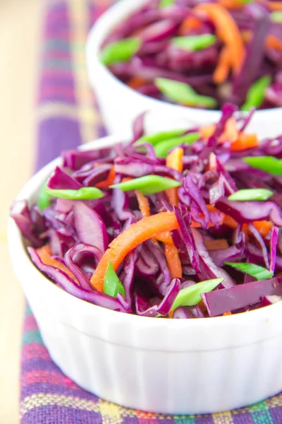 Salad with red cabbage and carrot in white cup — Stock Photo, Image