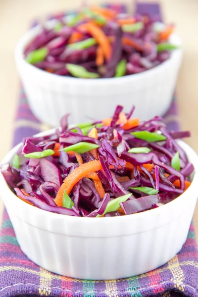 Salad with red cabbage and carrot in white cup — Stock Photo, Image
