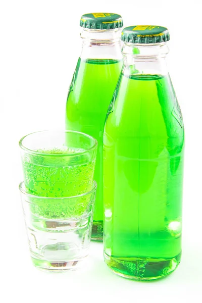 Green drink in bottle and small glass — Stockfoto