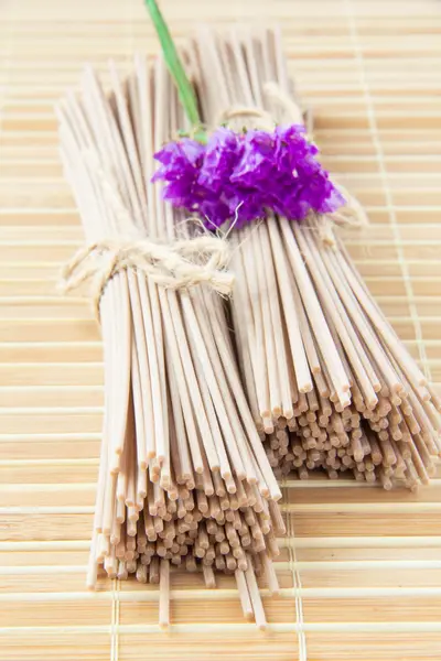 Portion of buckwheat noodles on bamboo table — Stock Photo, Image