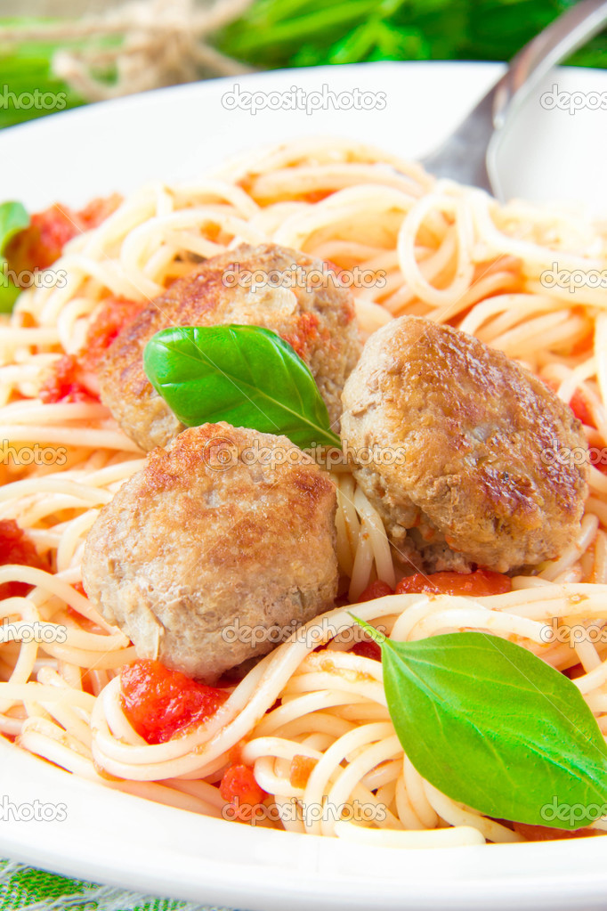 Traditional Italian dish of spaghetti with tomato sauce and meat