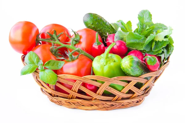 Fresh spring vegetables for salad in basket — Stock Photo, Image