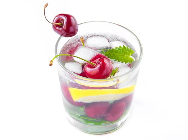 Refreshing summer drink with mint, cherry, lemon and ice — Stock Photo, Image