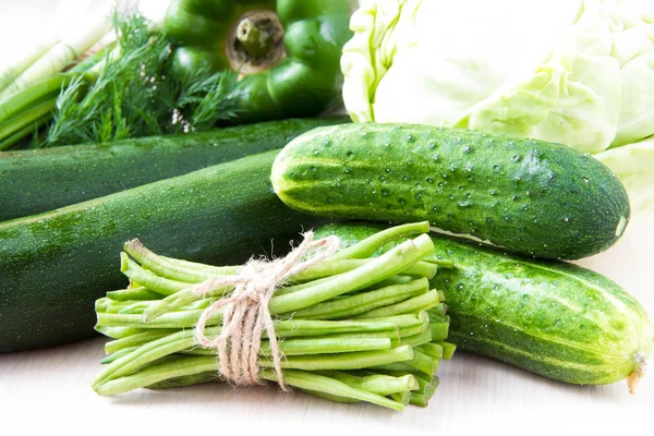 Assortment of fresh green vegetables for health - summer harvest — Stock Photo, Image