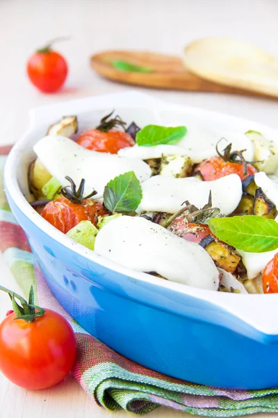 Mixed vegetable in blue bowl baked in the oven with cheese and b — Stock Photo, Image