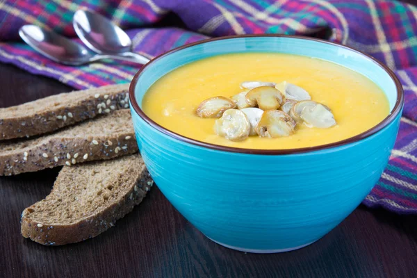 Delicious autumn pumpkin soup with mushrooms champignon — Stock Photo, Image