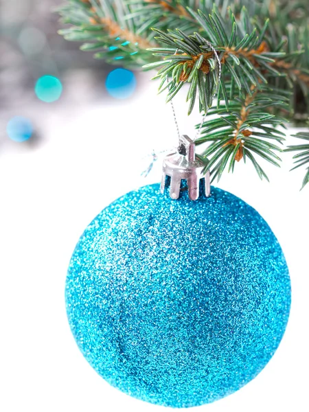Brilliant blue ball weighs on Christmas tree, isolated on white — Stock Photo, Image