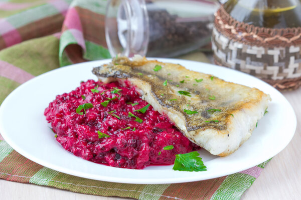 Fried fish fillet of perch with mashed beet and potato