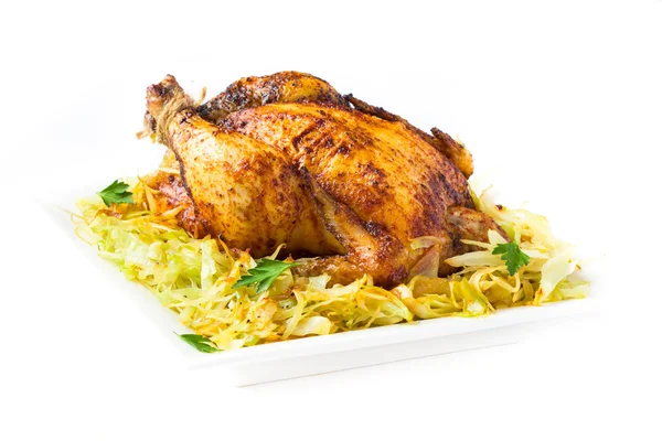 Roasted whole chicken with golden crust and garnish of stewed ca — Stock Image Roasted whole chicken with golden crust and garnish of stewed ca Royalty Free Stock Images