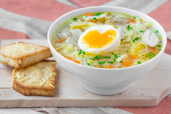 Chicken soup with noodles, carrots and cheese croutons — Stock Image Chicken soup with noodles, carrots and cheese croutons Royalty Free Stock Photos