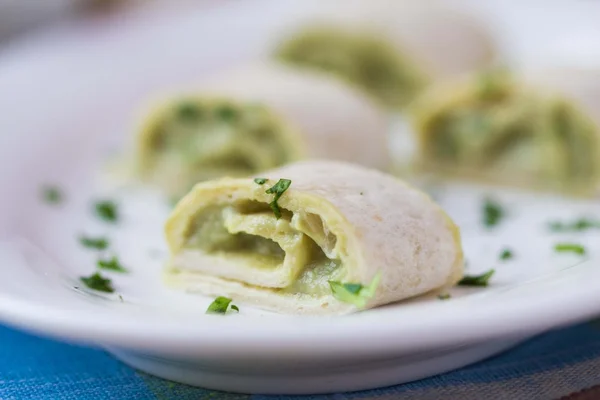 Rolls wrapped bread, tortilla, pita stuffed with avocado cream, — Stock Photo, Image