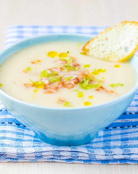 Delicious vegetable cream soup with potatoes, celery, ham, fresh — Stock Image Delicious vegetable cream soup with potatoes, celery, ham, fresh Royalty Free Stock Photos