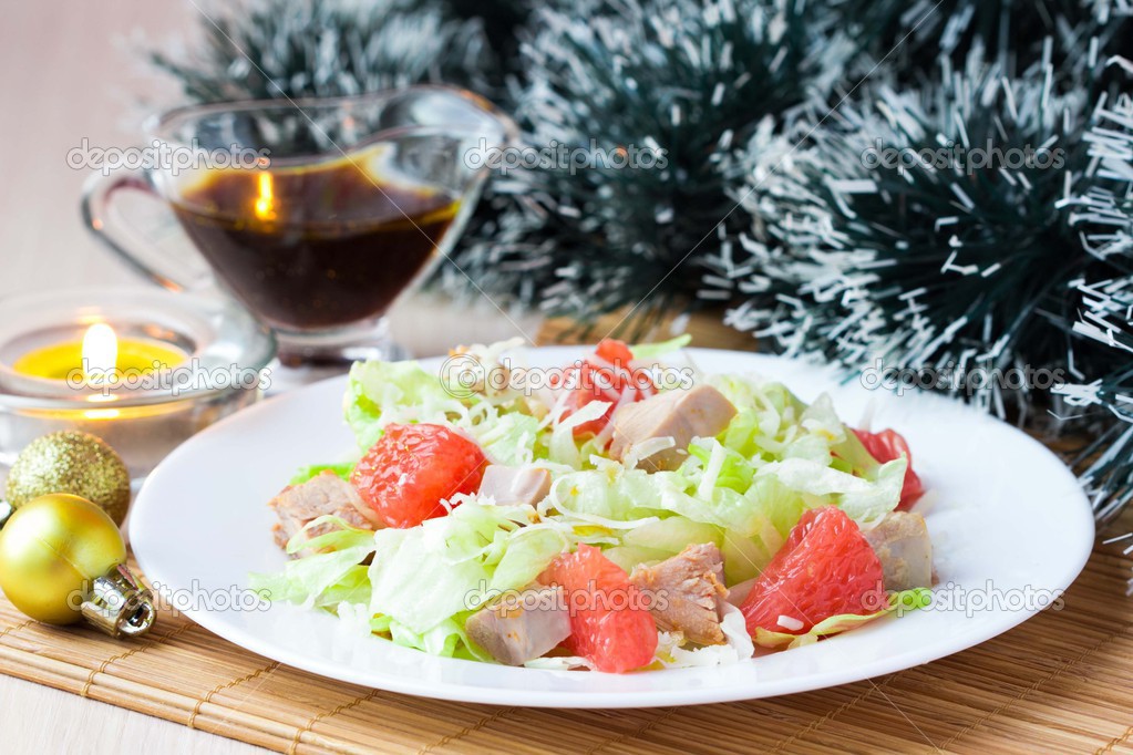 Delicious fresh salad with grapefruit, chicken, lettuce, cheese