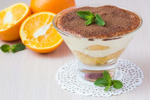 Orange tiramisu with mint, mascarpone cheese, savoyardi biscuit, — Stock Photo, Image