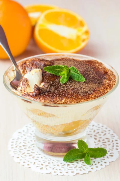 Orange tiramisu with mint, mascarpone cheese, savoyardi biscuit, — Stock Photo, Image