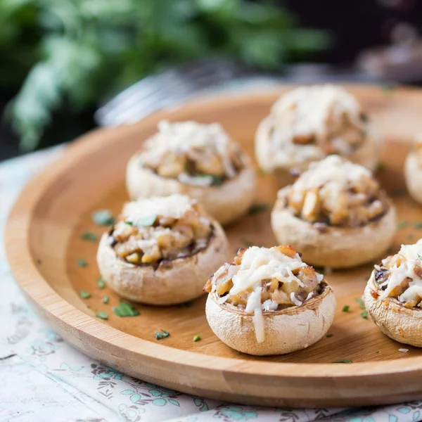 Mushroom champignons stuffed with filling of chicken, cheese, de — Stock Photo, Image