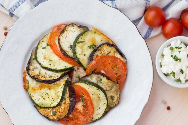 Ratatouille, vegetables cut on slices, eggplant, zucchini, tomat