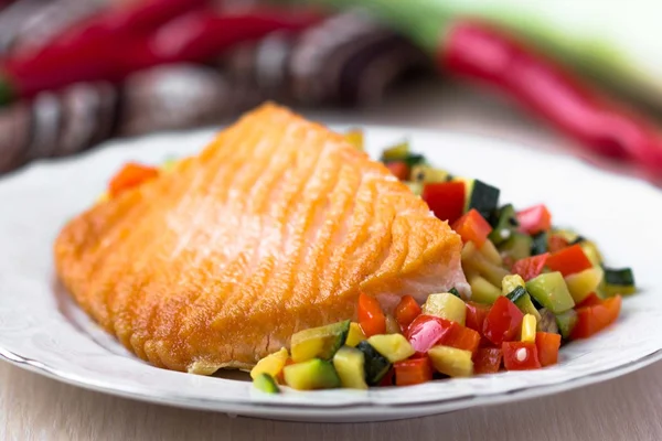 Fried fillet of red fish salmon with roasted vegetables, zucchin — Stock Photo, Image