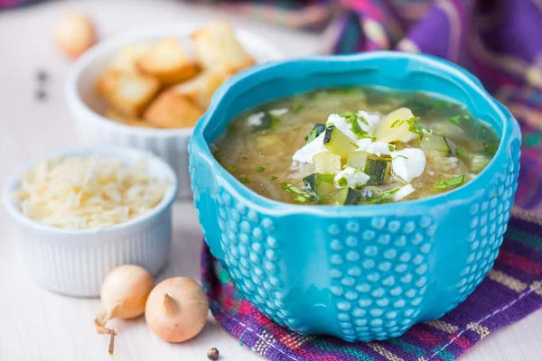 Onion soup with rice, feta cheese, zucchini, croutons, tasty dis — Stock Image Onion soup with rice, feta cheese, zucchini, croutons, tasty dis Royalty Free Stock Images