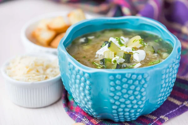 Onion soup with rice, feta cheese, zucchini, croutons, tasty dis — Stock Image Onion soup with rice, feta cheese, zucchini, croutons, tasty dis Stock Photo