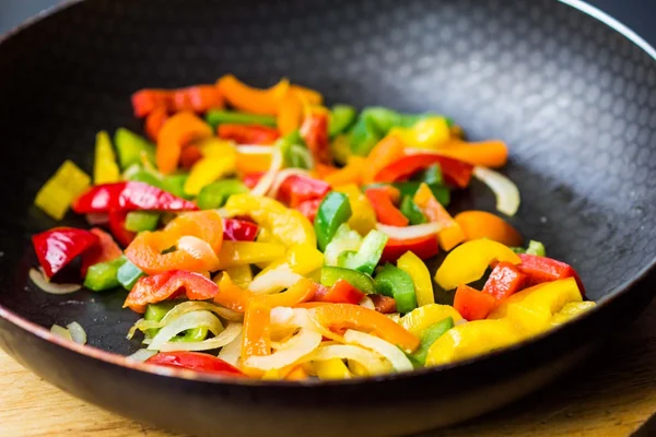 Mixed colorful peppers paprica fried in pan — Stock Photo, Image