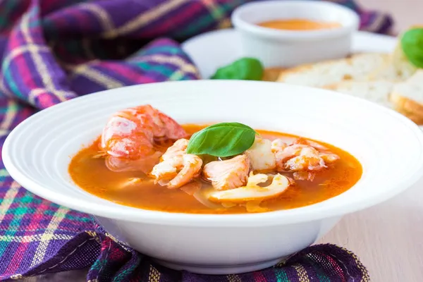 French Bouillabaisse fish soup with seafood, salmon, shrimp, ric — Stock Image French Bouillabaisse fish soup with seafood, salmon, shrimp, ric Stock Picture