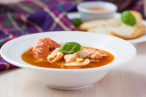 French Bouillabaisse fish soup with seafood, salmon, shrimp, ric — Stock Image French Bouillabaisse fish soup with seafood, salmon, shrimp, ric Stock Photo