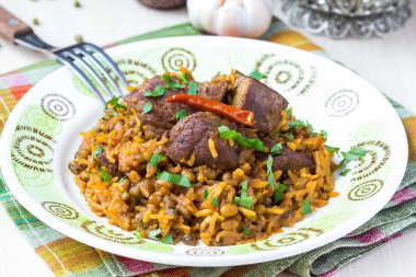 Plov, pirinç, et, sığır, koyun eti, pilav lapa kuru fasulye.