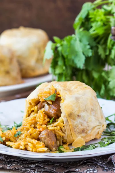 Oriental shah pilaf, pilaw, plov, rice with meat in filo — Stock Photo, Image