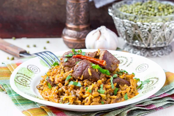 Plov, pilaf with rice, meat, beef, mutton, beans mash — Stock Photo, Image