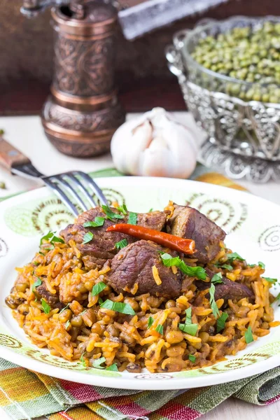 Plov, pilaf with rice, meat, beef, mutton, beans mash — Stock Photo, Image