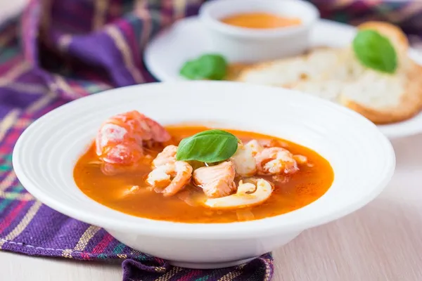 French Bouillabaisse fish soup with seafood, salmon, shrimp, ric — Stock Image French Bouillabaisse fish soup with seafood, salmon, shrimp, ric Stock Photo