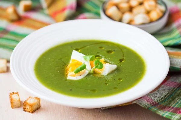 Green spring, summer healthy cream soup with herbs, egg, crouton — Stock Image Green spring, summer healthy cream soup with herbs, egg, crouton Stock Photo