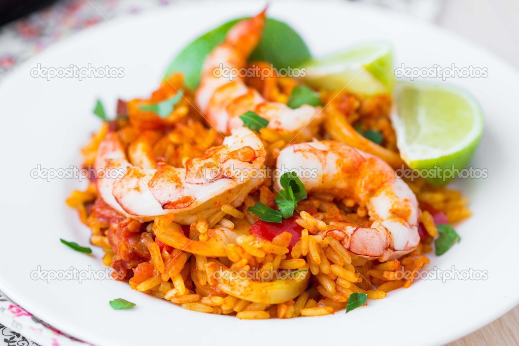 Spanish dish paella with seafood, shrimps, squid, rice, saffron