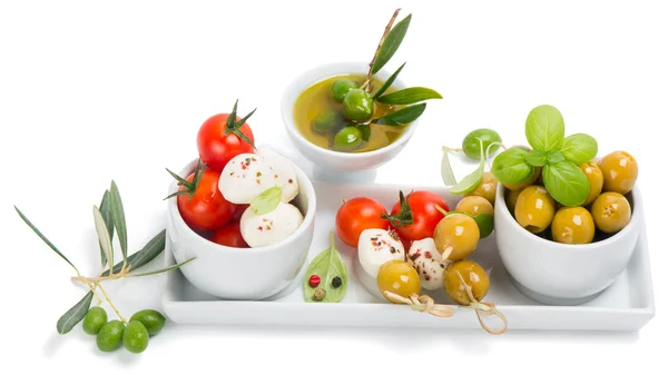 Mozzarella cheese with tomatoes,  olives and spices — Stock Photo, Image