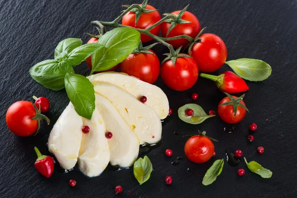 View from above of Tomatoes with mozzarella and  spices — Stock Photo, Image
