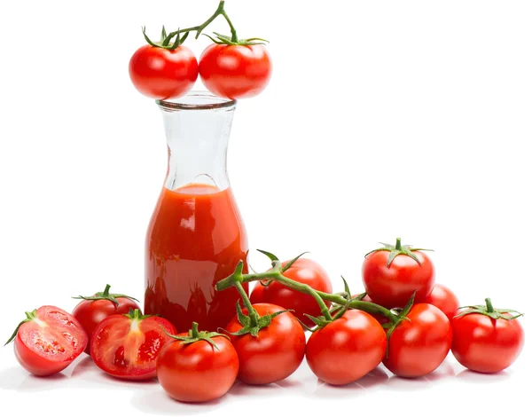 Fresh tomato juice and ripe tomatoes — Stock Photo, Image