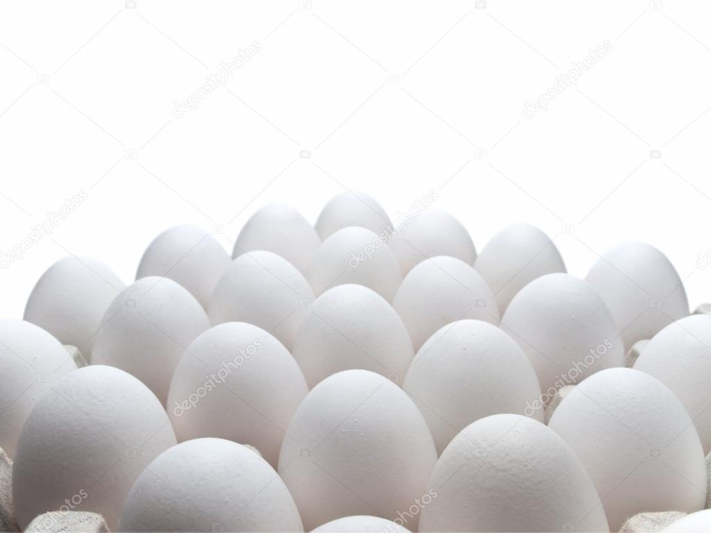 Eggs of a hen in packing on a white background.
