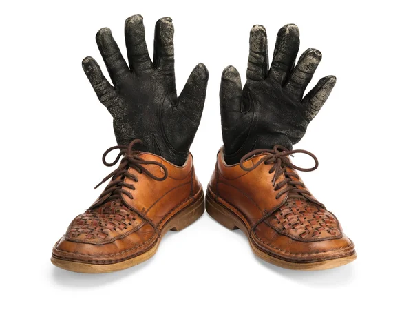 Old leather shoes and gloves. — Stock Photo, Image