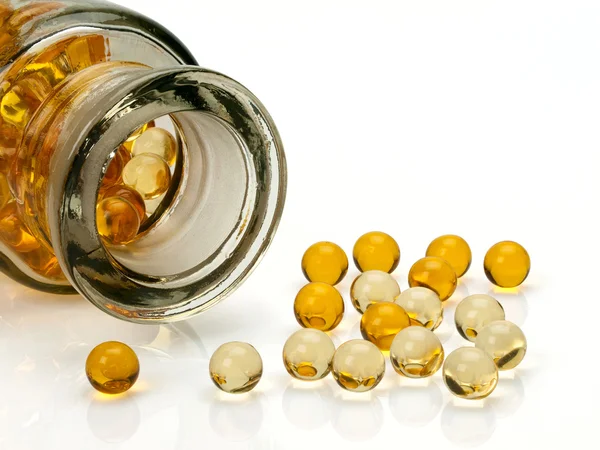 Pills with cod-liver oil — Stock Photo, Image