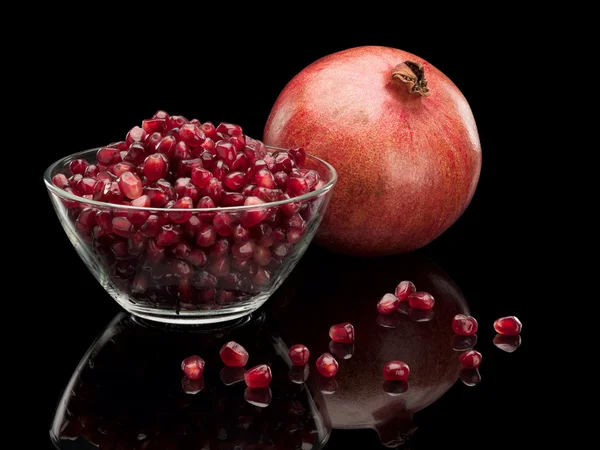 Vase with grains and a pomegranate fruit — Stock Photo, Image