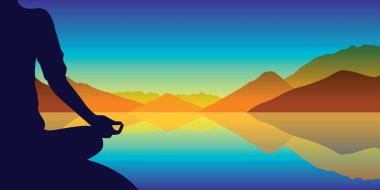 sonbahar dağları arka plan ile göl kenarında meditasyon silueti